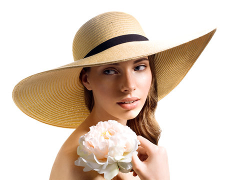 Tender girl in the summer image of a flower wit hat