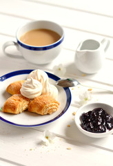 homemade biscuits, meringues and tea with milk 