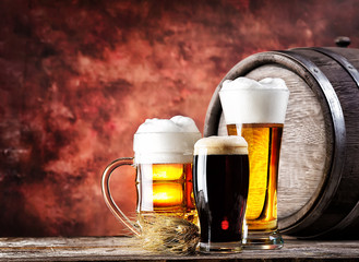 Mugs and glasses with light dark beer