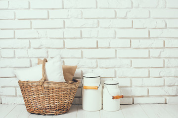 basket with a pillow and milk cans 