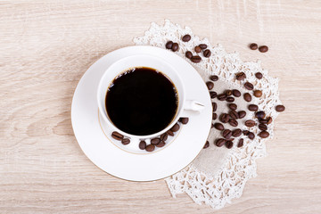 Obraz na płótnie Canvas Coffee cup with coffee beans
