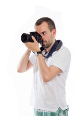 Obraz premium Young photographer isolated on white