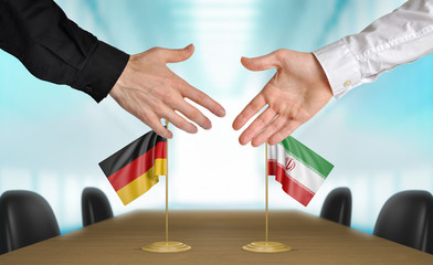 Germany and Iran diplomats agreeing on a deal