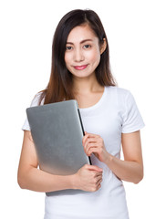 Naklejka premium Young lady hold with laptop computer