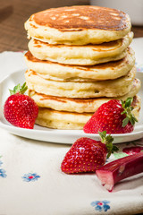 Stack of pancakes with strawberries