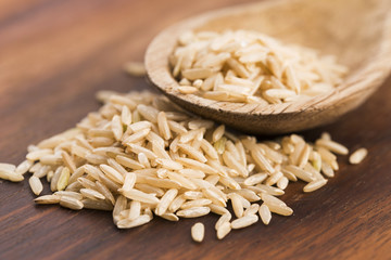 Spoon of brown rice close up