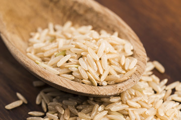 Spoon of brown rice close up