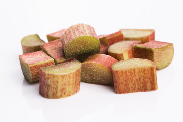 chopped red rhubarb on white background