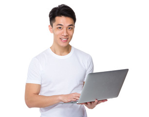 Young man use of laptop computer