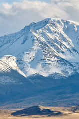 Fototapeta na wymiar Mountains covered with snow in Altai in spring