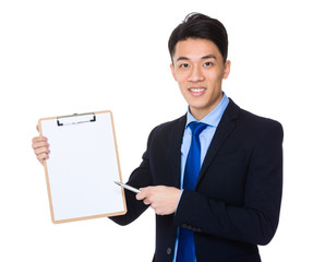 Businessman pen point to clipboard