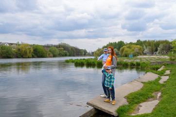 a mother plays the nature with babies