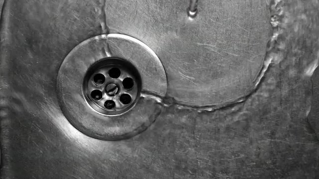 Water drains in the sinker