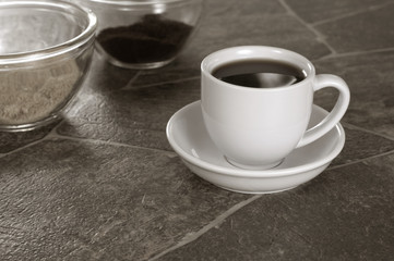 Sepia Toned White Coffee Cup on Granite Counter