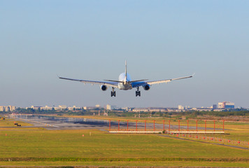 passenger plane appoaching to landing on airport runways