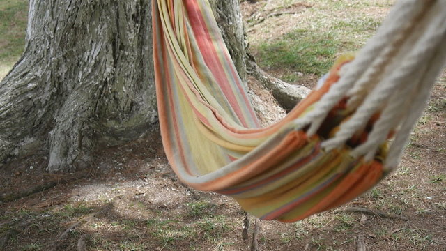 Swinging hammock in the wind in a quiet setting