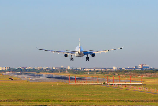 Fototapeta passenger plane appoaching to landing on airport runways