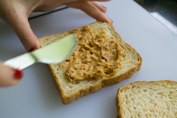 Making peanut butter sandwiches