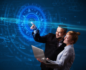 Young tech couple pressing high technology control panel screen