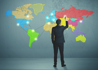 businessman drawing map on wall