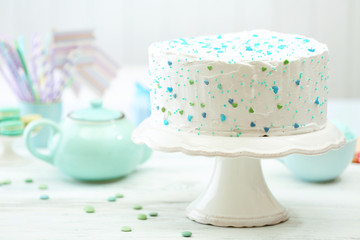 Birthday decorated cake on white wall background