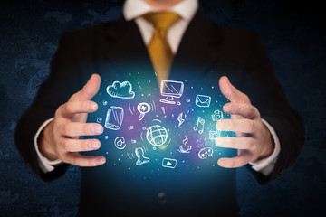 holding hand drawn media icons