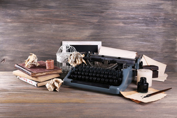 Retro typewriter on wooden background