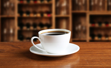 Cup of coffee on table in coffee shop