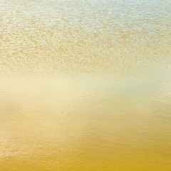 golden water texture background close up
