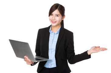 Young businesswoman use of the laptop computer and open hand pal