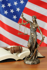 Themis and gavel on USA flag background