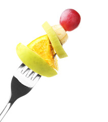Fototapeta na wymiar Snack of fruits on fork isolated on white