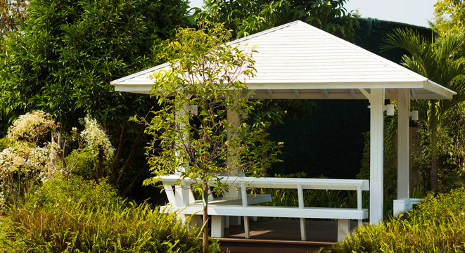 White pavilion in garden design
