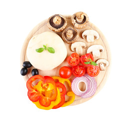 Food ingredients for pizza on cutting board isolated on white