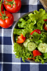 fresh vegetable salad in bowl on table close up