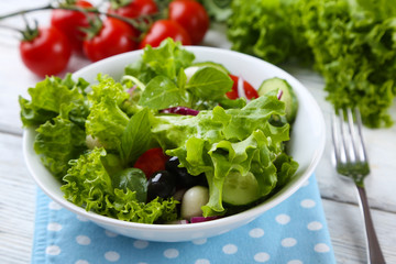 fresh vegetable salad in bowl on table close up