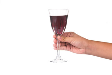 Hand holding red wine in crystal glass ready to toast