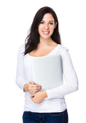 Brunette woman holding with laptop computer