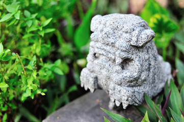 Lion statue in nature place soft light
