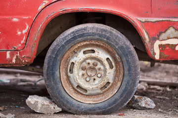Fototapeta na wymiar Close-up photo of rusty car wheel