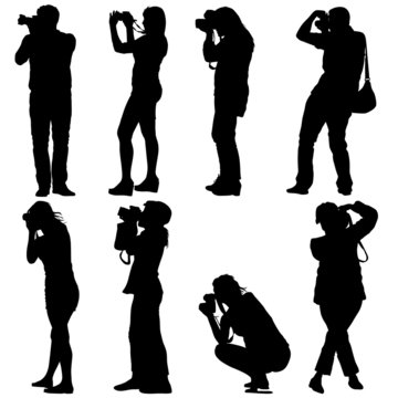 Cameraman with video camera. Silhouettes on white background. Ve
