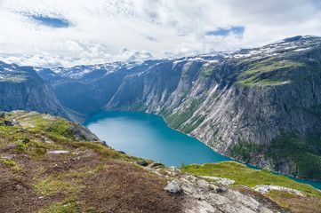 Hiking route to Trolltunga near lake valley and mountains
