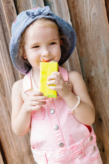 happy little girl drinking juice