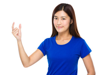 Young woman with finger show with small distance