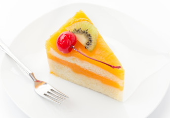 orange cake with kiwi and cherry