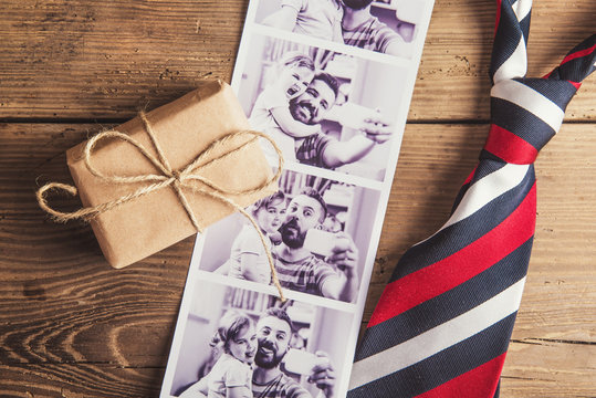 Fathers day composition. Studio shot on wooden background.
