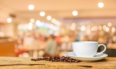 Coffee shop blur background with bokeh image .