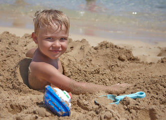 Boy play on th beach