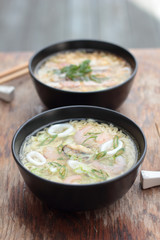 Bowl of oriental noodle and seafood soup.