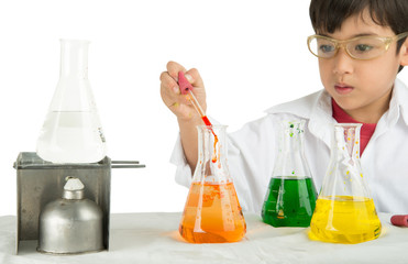 Little boy learning in chemecal in science in class